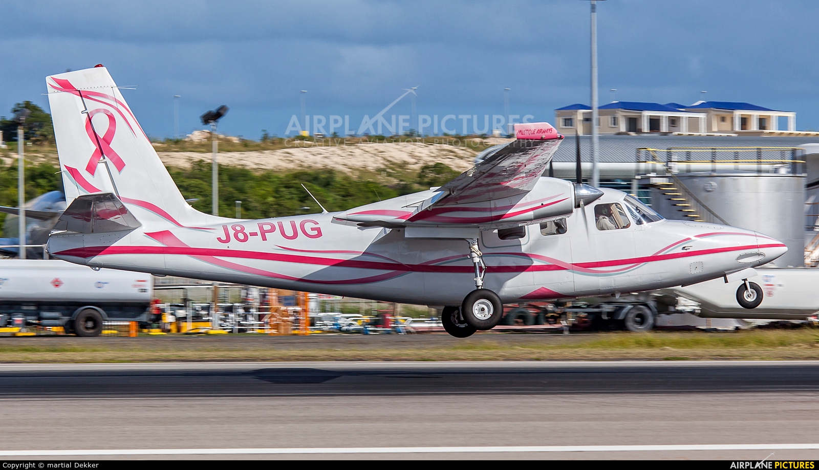 Mustique Airways J8-PUG aircraft at Sint Maarten - Princess Juliana Intl