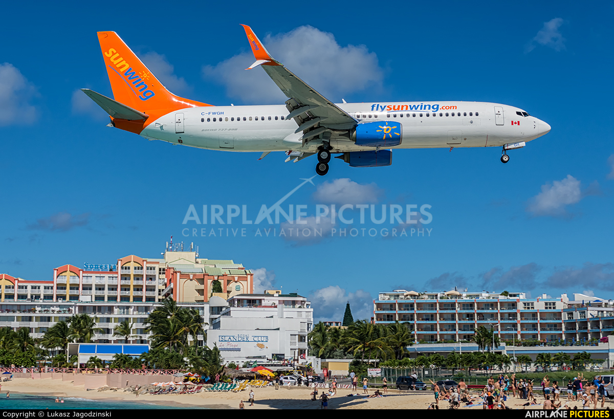 Sunwing Airlines C-FWGH aircraft at Sint Maarten - Princess Juliana Intl